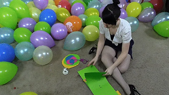 Secretary Dakota Popping Balloons from Office Party