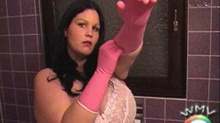 Housewife with pink tight rubbergloves cleaning toilet and fucking with a XXL Dildo