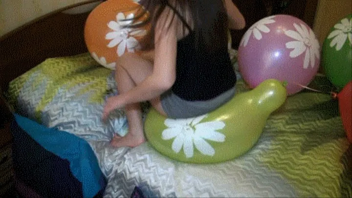 Flower balloons on the bed