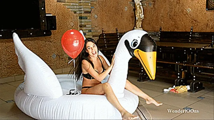 Popping and tearing huge inflatable swan