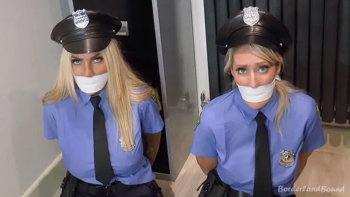 Rachel-Lei & Emma in: StakeOut TakeOut!! Hot Demoted Cop Cuties Secured with Their Own Cuffs & All Gagged Up in the Sales Kiosk! (Extra Fun Cut)