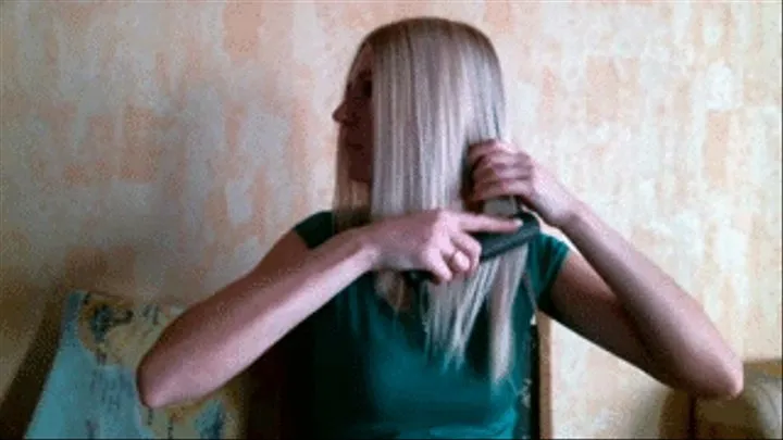 Brushing beautiful straight blonde hair