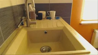 Hair washing in kitchen sink