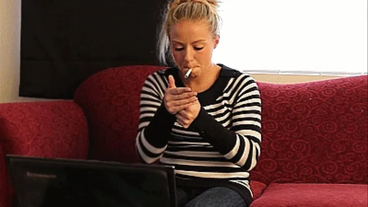 Ashley smokes and uses the computer