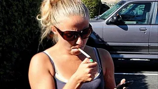 Ashley smokes in the parking lot