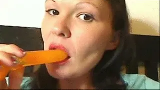 Sarah sucks on a Popsicle