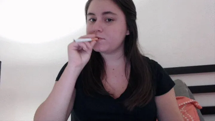 Smoking in a black shirt