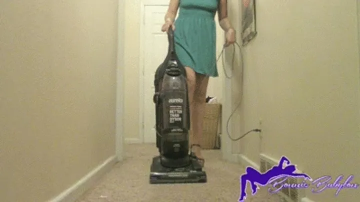 Blue dress hallway vacuuming