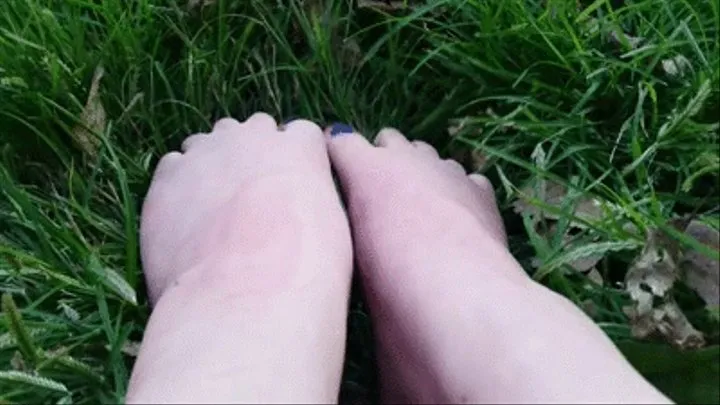 Purple toes in green grass