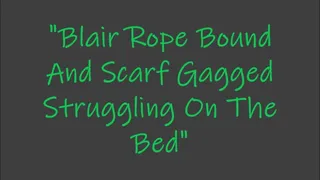"Blair Rope Bound and Scarf Gagged Struggling On The Bed"