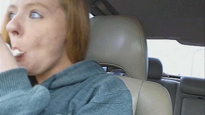 Petite Ashley eats in the car