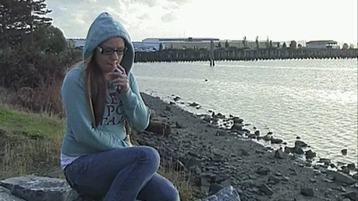 Petite Ashley smokes on the beach 2