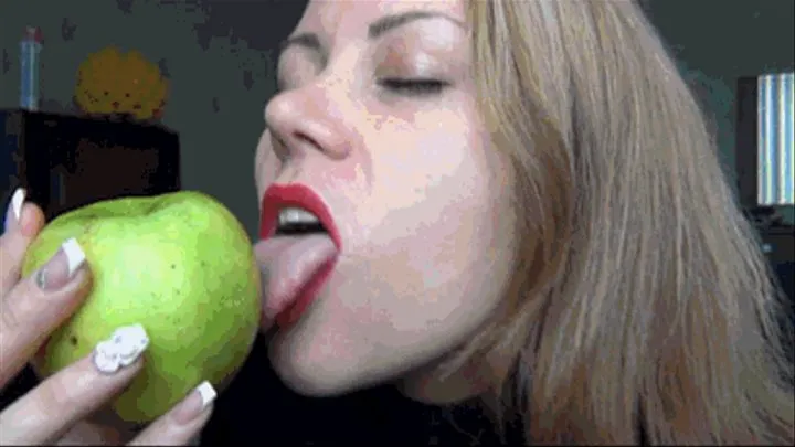 Lipstick marks and lip tease on a green apple I