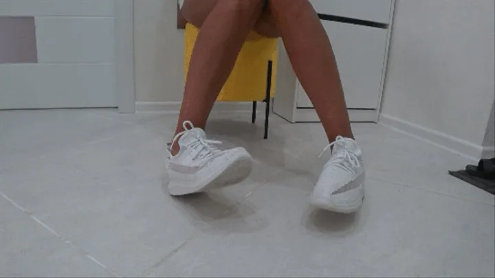 toe wiggling in white soft sneakers IV