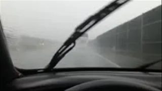 Fast driving in rainy boots on highway