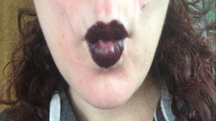 Eating Gummy Bears with black lipstick