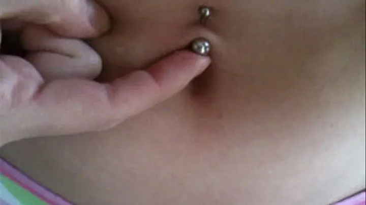 Playing with belly piercing