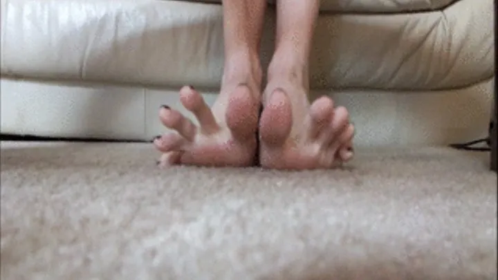 Watch long toes wiggle and spread under table