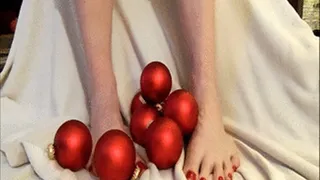 Long red toes fondle red christmas balls