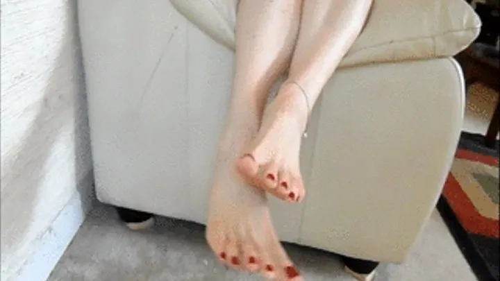 sexy feet and long legs dangling over sofa