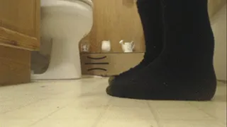 Dirty Mismatched Black Socks on Disgusting Floor