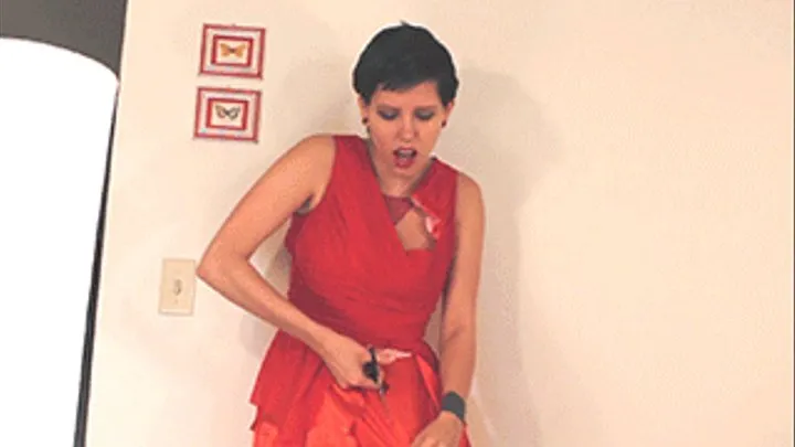 Destroying my little red dress with scissors and hands