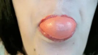 Blowing Pink Bubbles with Red Glossy Lips