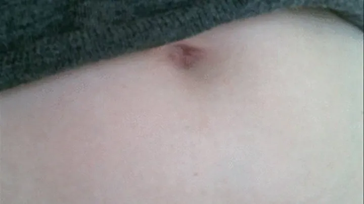 Belly Button Peeks Under Sweater - Extreme Close Up