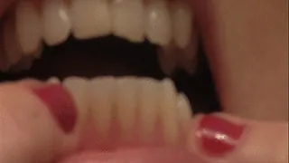 Blonde Inspects Teeth Thoroughly.