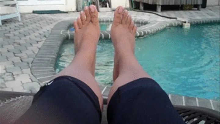 Feet by the pool