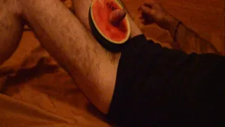 Our slave is playing with a watermelon!