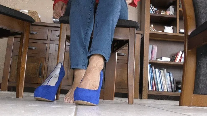 Voyeur View Mature Woman sitting at desk with High Heel Shoes