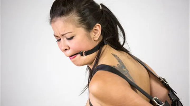 Jacky: Armbinder and Ball Gag