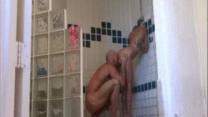 Johnny Sins eats Kissa's pussy from the back in the Shower