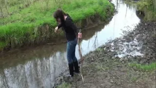 With riding boots in mud