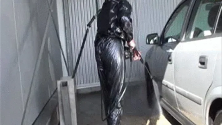 Car Wash in sauna suit and rubberboots