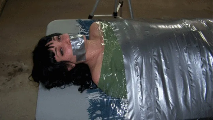 Alexia Ellis Duct Tape Mummification on a Table