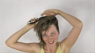 'Hair styling with spray, iron, blow dryer, brushing and hands'