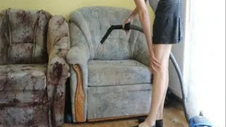 Vacuuming with a short tube, wearing flats