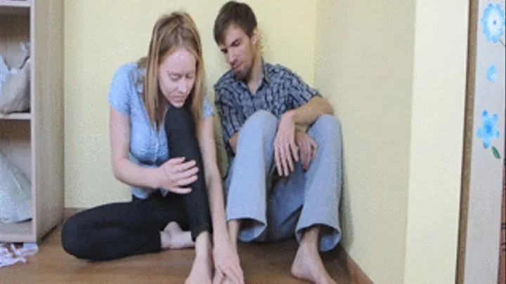 Comparing and measuring bare feet and hands with a man