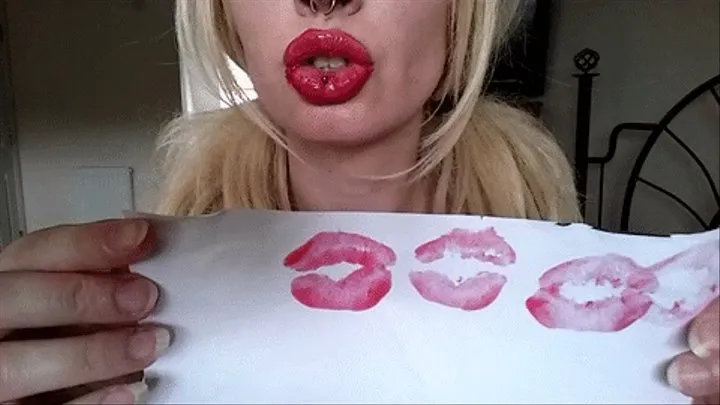 red lipgloss shiny messy kisses on white paper