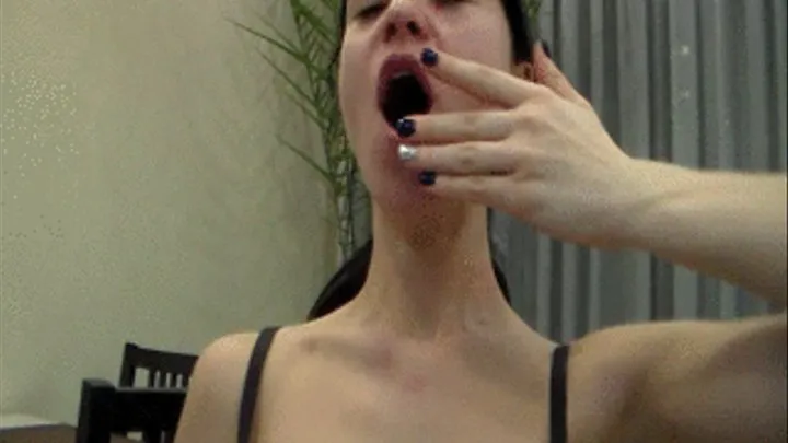 yawning woman, she so languidly opens her mouth, yawns, broad jaw