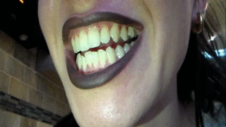 your black lipstick, highlights your whiteness of sharp teeth / fangs,