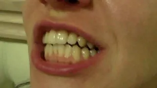 wide mouth miss brunette, sharp fangs, larynx/