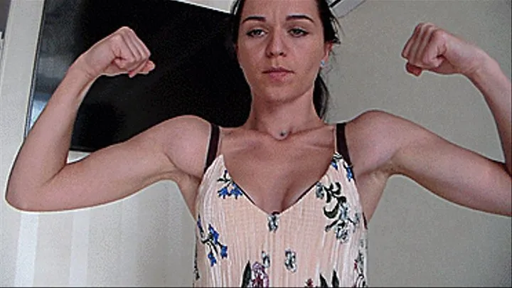 you are a muscular woman and show off your muscles, showing muscle, straining muscles, you find the veins on your hands, the pulses in them, your arms are tense and you are ready to pump the muscles of your arms, to increase the biceps and triceps*