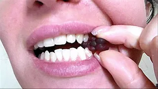 between sharp snow-white teeth clip