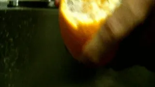 Hands Pull Apart An Orange