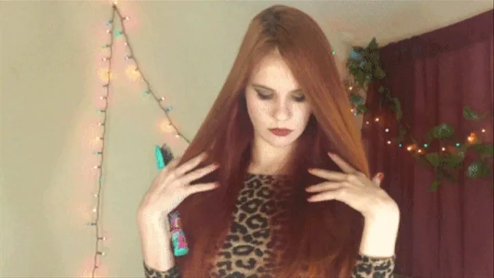 Brushing unstyled two toned shiny red hair