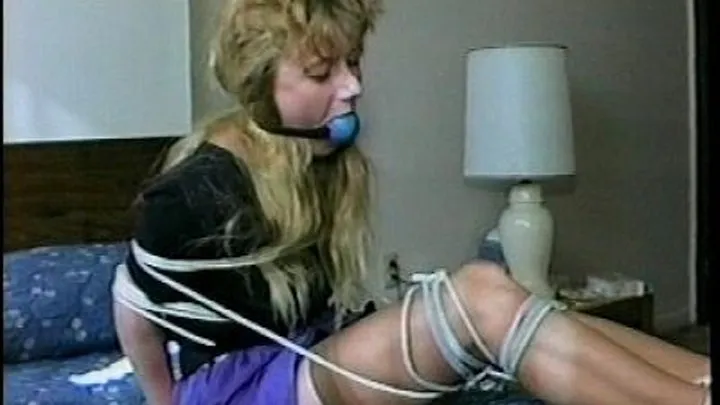 TAG Robyn 1- Purple Skirt, Heels, Thick White Cleave Gag, Blue Ball Gag, Tied Up Hands, Knees, Feet