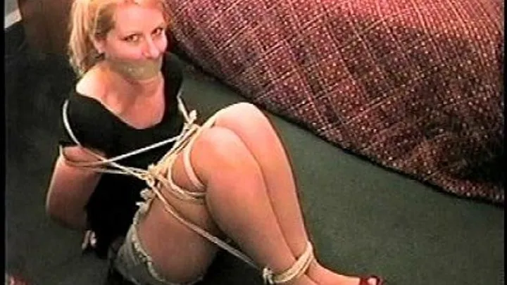 TAG Shyla 3- Gagged With Tape Wrapped Several Times Around Head, Ball Tied, Cut Off Jean Shorts